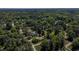 Aerial view of a neighborhood surrounded by dense trees, highlighting the serene residential setting at 2715 Freemont Rd, Durham, NC 27705
