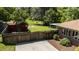 View of the house and backyard with a storage shed and green lawn area with chairs at 2715 Freemont Rd, Durham, NC 27705