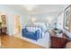 Spacious bedroom with hardwood floors, a sitting area, and an ensuite bathroom for added convenience at 2715 Freemont Rd, Durham, NC 27705