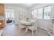 Charming breakfast nook featuring a round table with decorative runner and sunlit window at 2715 Freemont Rd, Durham, NC 27705