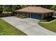 Aerial view of a brick home with a spacious driveway and well-maintained landscaping for added curb appeal at 2715 Freemont Rd, Durham, NC 27705
