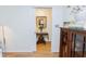 Hallway view into a dining area featuring hardwood floors and natural light at 2715 Freemont Rd, Durham, NC 27705