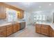Bright kitchen with light wood cabinets, white countertops, and ample natural light at 2715 Freemont Rd, Durham, NC 27705