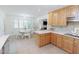 Eat-in kitchen with stainless steel appliances and dining table near a window at 2715 Freemont Rd, Durham, NC 27705