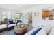 Inviting living room with seating, a decorative rug, and view to the dining area at 2715 Freemont Rd, Durham, NC 27705