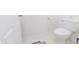 Simple powder room with a white toilet, neutral walls, and clean design at 2715 Freemont Rd, Durham, NC 27705