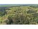 Expansive land for sale, showcased by aerial view with property lines marked, surrounded by lush trees and natural water features at 2925 Ericka Dr, Hillsborough, NC 27278