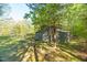 Idyllic setting with a classic barn and a fenced yard, providing ample space and privacy at 2925 Ericka Dr, Hillsborough, NC 27278