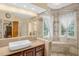 Bathroom with walk-in shower, modern sink, and luxury finishes at 2925 Ericka Dr, Hillsborough, NC 27278