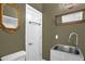 Bathroom with olive green walls, tile floors, sink and ornate mirrors at 2925 Ericka Dr, Hillsborough, NC 27278