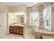 Bathroom with neutral tiling, vanity, and large walk-in shower at 2925 Ericka Dr, Hillsborough, NC 27278