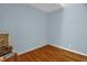 This is a spacious bedroom with hardwood floors and light blue walls at 2925 Ericka Dr, Hillsborough, NC 27278