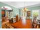 Dining room featuring a large table with seating for eight, and decorative chandelier at 2925 Ericka Dr, Hillsborough, NC 27278