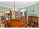 Open dining room with a spacious table and chairs with view of the kitchen at 2925 Ericka Dr, Hillsborough, NC 27278
