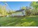 The cottage exterior features a well-maintained yard with a chain-link fence, promising a blend of comfort and outdoor enjoyment at 2925 Ericka Dr, Hillsborough, NC 27278