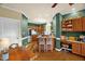 Eat-in kitchen features stainless steel appliances, bar seating, and custom cabinetry at 2925 Ericka Dr, Hillsborough, NC 27278