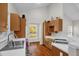 Vaulted kitchen with wood cabinets, white counter tops, and stainless steel sink at 2925 Ericka Dr, Hillsborough, NC 27278