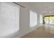 Bright living room featuring large windows and access to the outdoor deck at 2925 Ericka Dr, Hillsborough, NC 27278