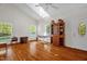 Sunlit living room featuring hardwood floors, large windows, and neutral walls for a bright and open feel at 2925 Ericka Dr, Hillsborough, NC 27278