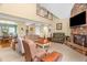 Open living room with a stone fireplace, high ceilings, and comfortable seating at 2925 Ericka Dr, Hillsborough, NC 27278