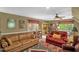 This living room includes a desk area, ceiling fan, and plenty of seating at 2925 Ericka Dr, Hillsborough, NC 27278