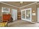 Neutral colored office with lots of lighting, tile floors, and french doors at 2925 Ericka Dr, Hillsborough, NC 27278