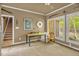 Sunlit office space featuring a wooden desk, neutral walls, and picturesque windows at 2925 Ericka Dr, Hillsborough, NC 27278