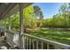 Outdoor space, featuring a covered porch, views of the landscaped yard, and access to the property's lush surroundings at 2925 Ericka Dr, Hillsborough, NC 27278