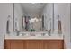 Bathroom featuring double sinks, vanity, and decorative flower at 3114 Courtney Creek Blvd, Durham, NC 27713