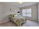 Comfortable bedroom with a window and neutral colored walls at 3114 Courtney Creek Blvd, Durham, NC 27713