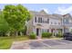 Attractive townhouse with a neat lawn, parking spaces, and landscaping features for curb appeal at 3114 Courtney Creek Blvd, Durham, NC 27713