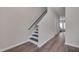 Hallway with wood flooring and a staircase leading to the upper level at 3114 Courtney Creek Blvd, Durham, NC 27713