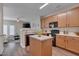 Efficient kitchen with black appliances, light cabinets, and a functional island for meal prep at 3114 Courtney Creek Blvd, Durham, NC 27713