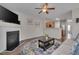 Open living room with fireplace flowing into the kitchen at 3114 Courtney Creek Blvd, Durham, NC 27713