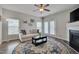 Bright living room with hardwood floors, fireplace, and access to patio at 3114 Courtney Creek Blvd, Durham, NC 27713