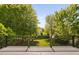 Beautiful backyard view from the deck with lush landscaping and mature trees at 3302 Colorcott St, Raleigh, NC 27614
