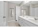 This bathroom has a double sink, a towel rack, and a mirror for a clean and classic look at 3302 Colorcott St, Raleigh, NC 27614
