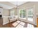 Sun-drenched breakfast nook with bench seating and direct access to outdoor space at 3302 Colorcott St, Raleigh, NC 27614
