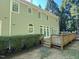 Backyard features a spacious wooden deck, with a well maintained green lawn at 3316 Belspring Ln, Raleigh, NC 27612