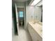 Clean bathroom features double sinks, neutral walls, and a convenient doorway to toilet and shower at 3316 Belspring Ln, Raleigh, NC 27612