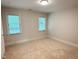 Inviting bedroom with plush carpeting, neutral walls, and large window for great natural light at 3316 Belspring Ln, Raleigh, NC 27612