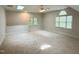 Spacious bonus room featuring plush carpeting, natural light from the skylights, and neutral color palette at 3316 Belspring Ln, Raleigh, NC 27612