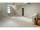 Large bonus room offers lots of light, plush carpeting, and potential as a playroom or entertainment area at 3316 Belspring Ln, Raleigh, NC 27612