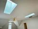 Bright bonus room featuring multiple skylights, ceiling fan, and a neutral color scheme for easy customization at 3316 Belspring Ln, Raleigh, NC 27612