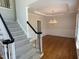 Dining room featuring hardwood floors, chandelier, and wainscoting at 3316 Belspring Ln, Raleigh, NC 27612