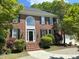 Charming two-story brick home with black shutters and a well-manicured lawn at 3316 Belspring Ln, Raleigh, NC 27612