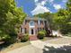 Traditional brick home boasts lush landscaping and a welcoming entrance at 3316 Belspring Ln, Raleigh, NC 27612