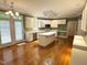 Spacious kitchen features an island, white cabinets, and stainless steel appliances at 3316 Belspring Ln, Raleigh, NC 27612