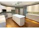 Charming kitchen featuring an island, white cabinets and an eat-in breakfast area at 3316 Belspring Ln, Raleigh, NC 27612