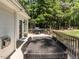 Spacious back deck with ample seating, a grill, and a view of the lush backyard, perfect for outdoor entertaining at 3332 Langston Cir, Apex, NC 27539